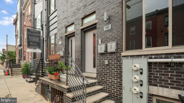 entrance to property with brick siding