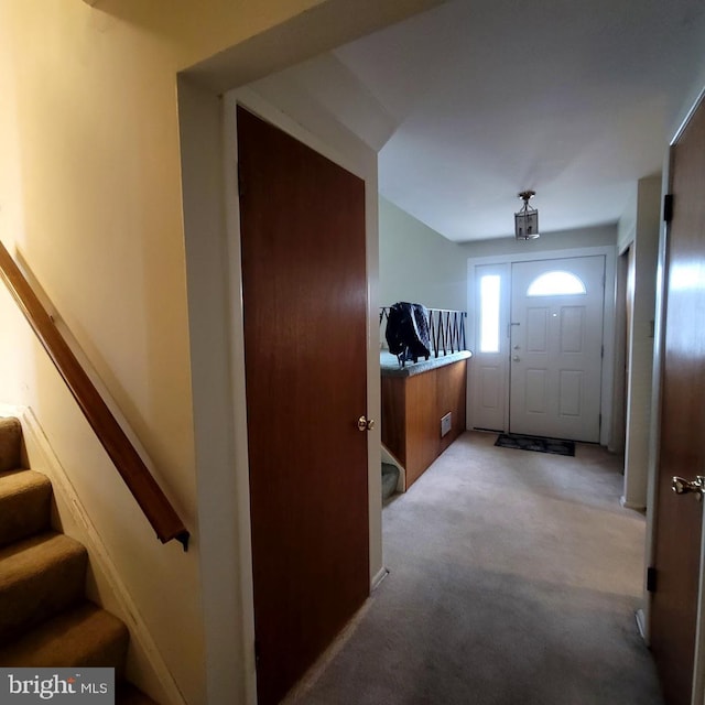 entryway with light carpet