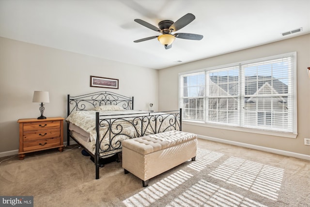 bedroom with multiple windows, visible vents, and baseboards