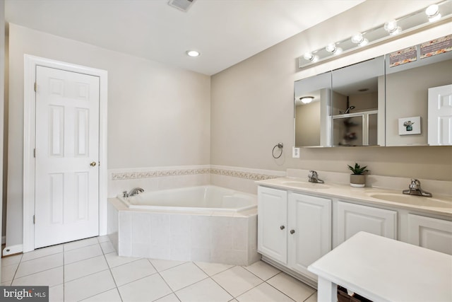 full bath featuring double vanity, tile patterned flooring, a sink, and a bath