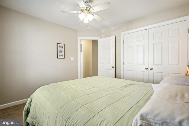 bedroom with a ceiling fan, a closet, baseboards, and carpet flooring