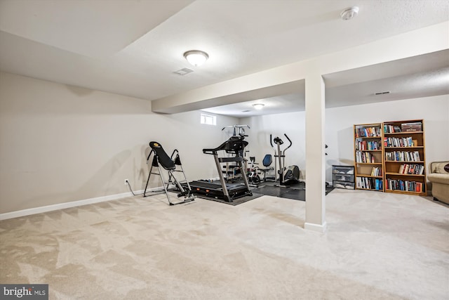 exercise area with carpet and baseboards