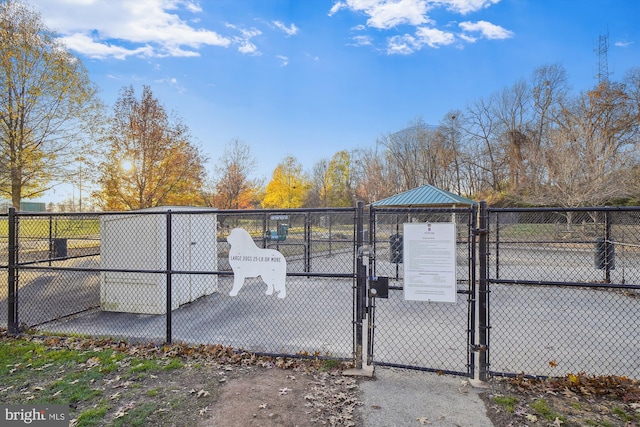 view of gate with fence