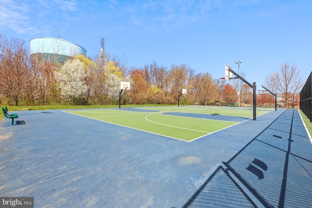 view of sport court featuring community basketball court and fence