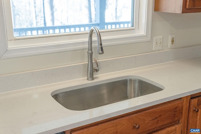 interior details with light stone counters and sink