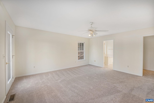 carpeted empty room featuring ceiling fan