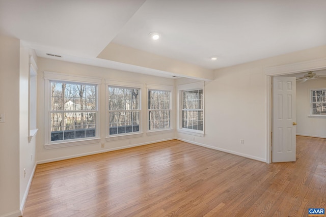 unfurnished room with light hardwood / wood-style flooring