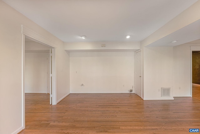 basement featuring wood-type flooring