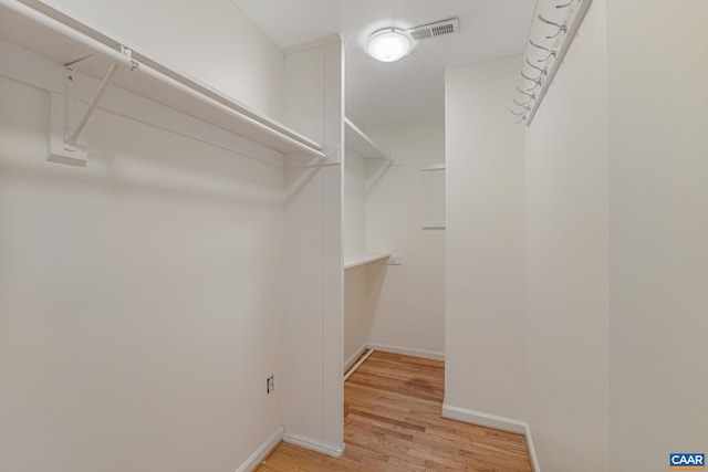 spacious closet featuring light wood-type flooring