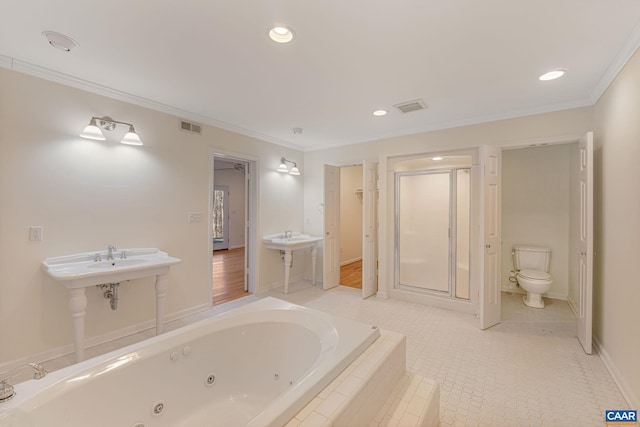 bathroom featuring ornamental molding, shower with separate bathtub, and toilet