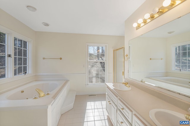 bathroom featuring vanity, plus walk in shower, and tile patterned flooring