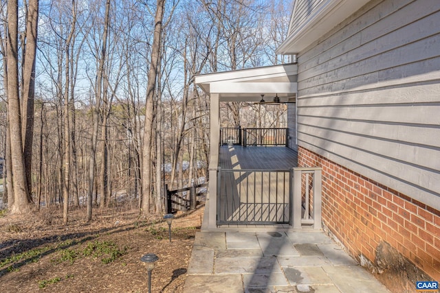 exterior space with ceiling fan