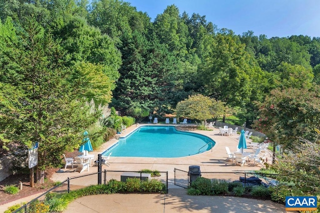 view of pool featuring a patio area