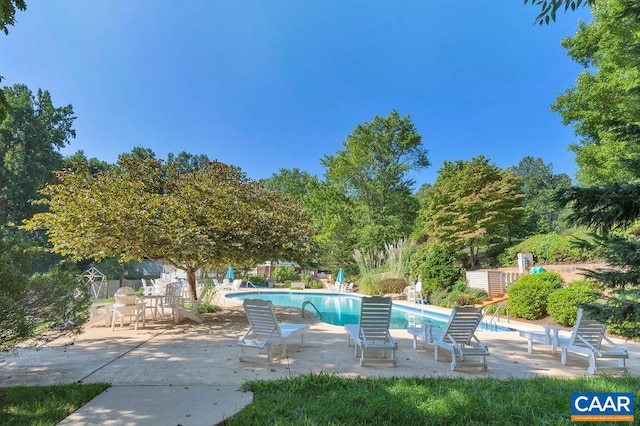 view of swimming pool featuring a patio