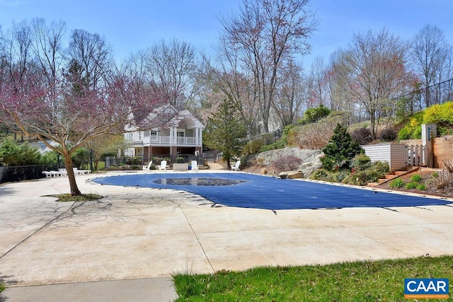 view of swimming pool featuring a patio area