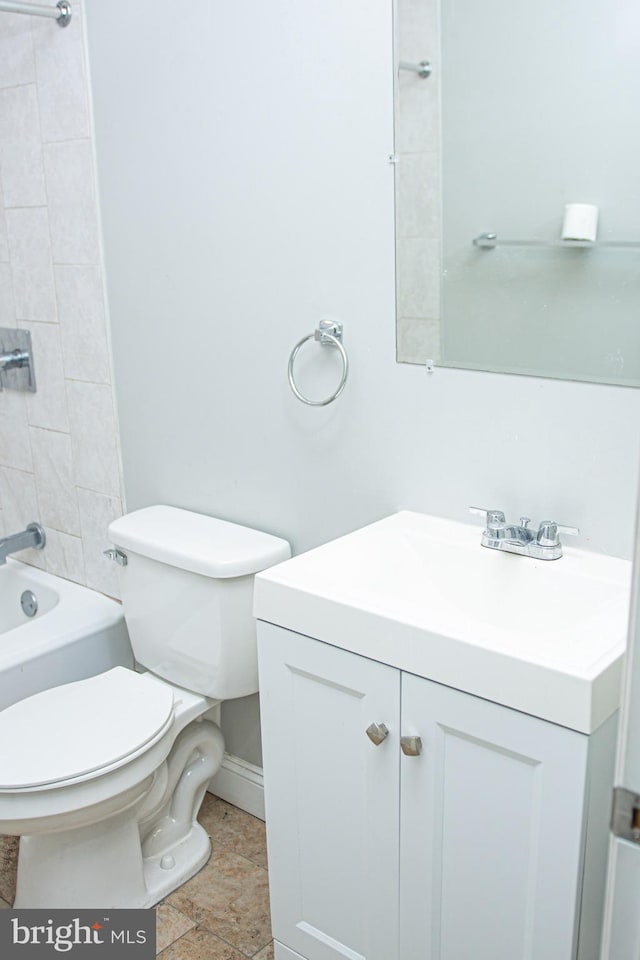 full bathroom with tiled shower / bath combo, vanity, and toilet