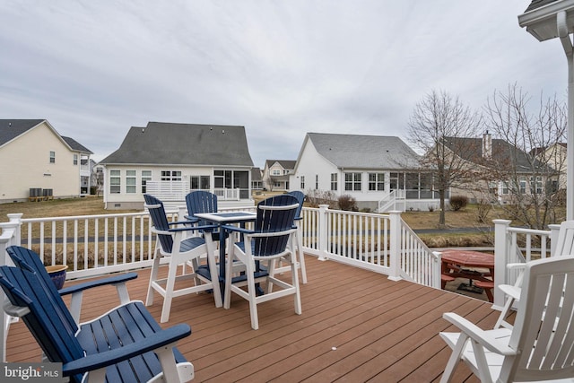 wooden terrace with central AC unit and a jacuzzi