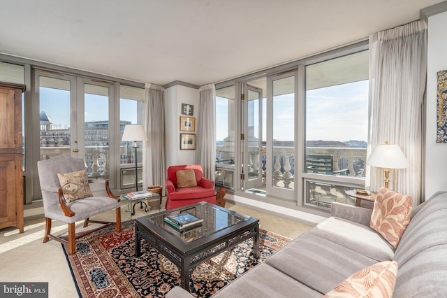 living room featuring floor to ceiling windows and french doors