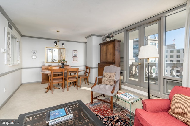 carpeted living room featuring ornamental molding