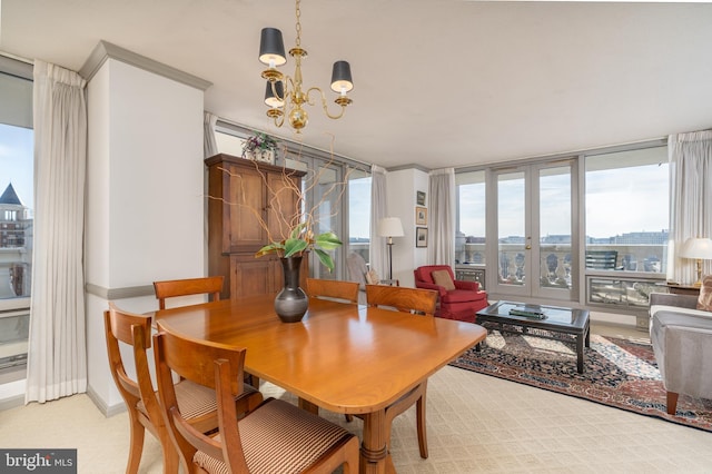 carpeted dining area featuring a notable chandelier and french doors