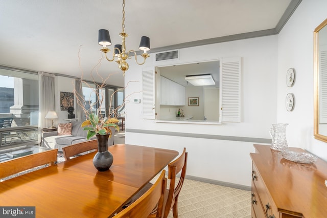 dining space with a notable chandelier and ornamental molding