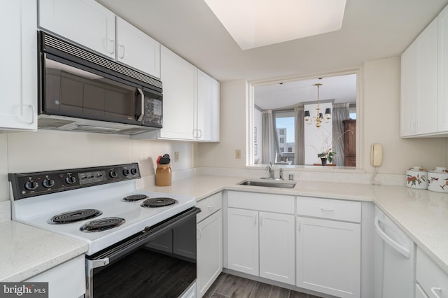 kitchen featuring range with electric cooktop, sink, white cabinets, and light hardwood / wood-style flooring