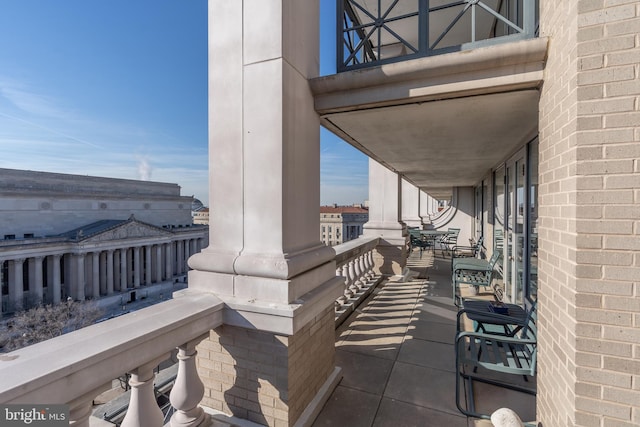 view of patio featuring a balcony