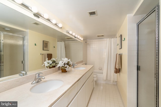 bathroom featuring tile patterned flooring, vanity, and toilet