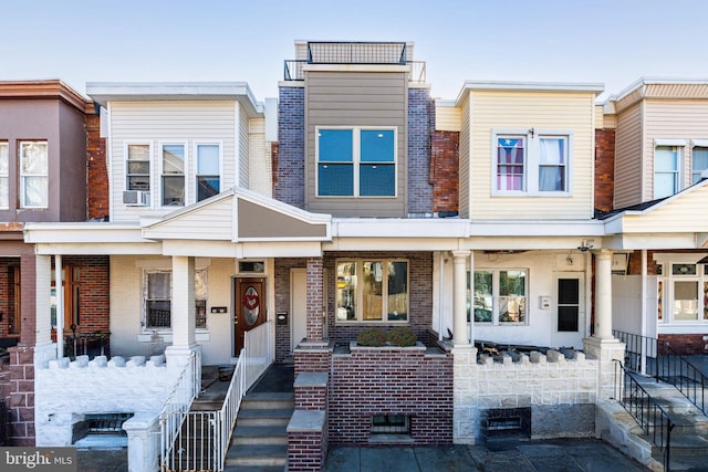 view of front of home featuring cooling unit and covered porch