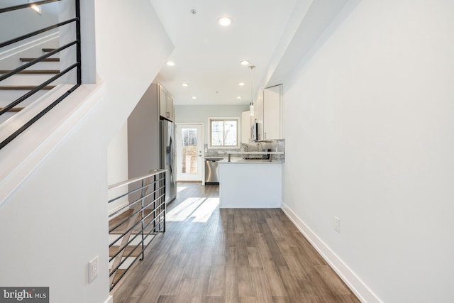 corridor featuring dark hardwood / wood-style floors