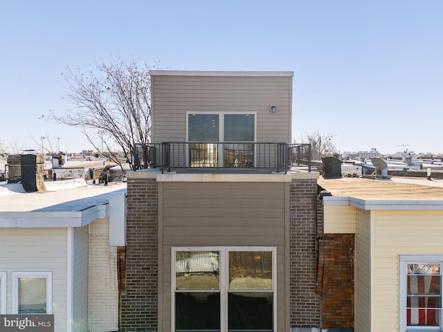 view of property exterior with a balcony