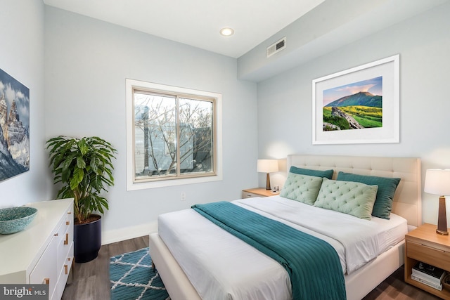 bedroom with dark wood-type flooring