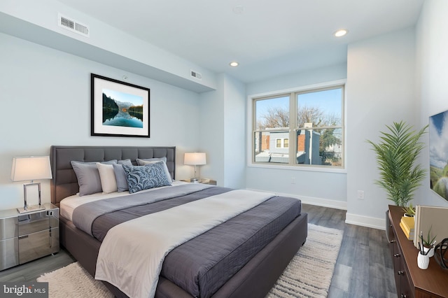 bedroom with dark wood-type flooring