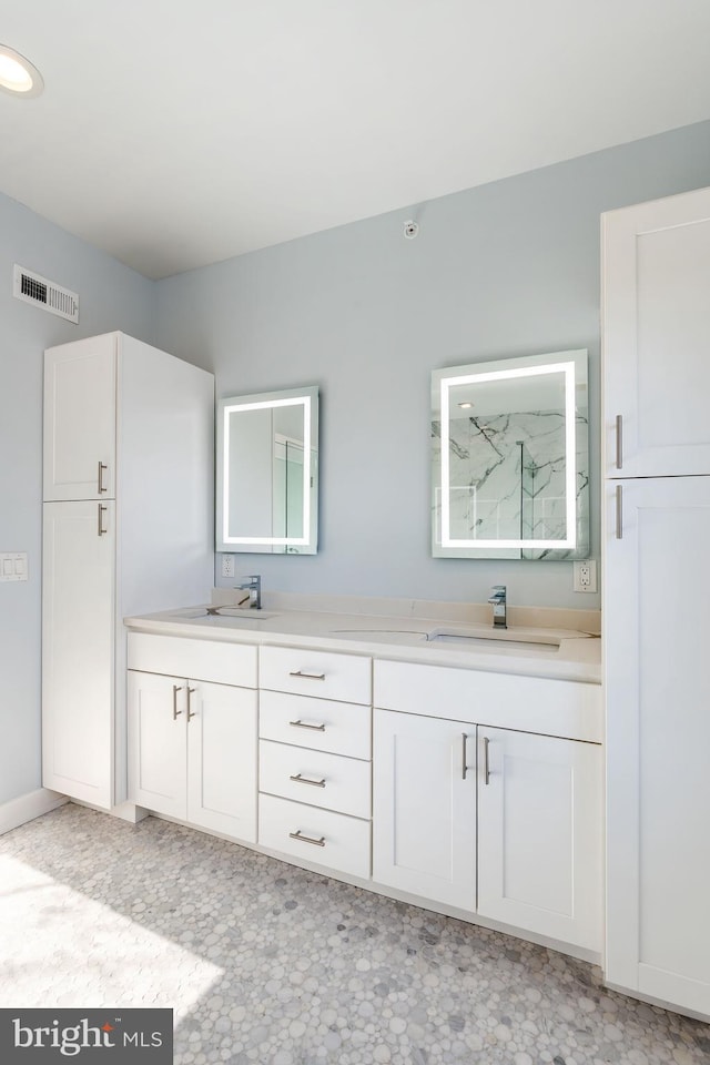 bathroom with vanity and walk in shower