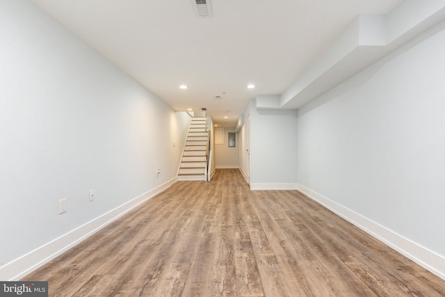 basement featuring light hardwood / wood-style floors