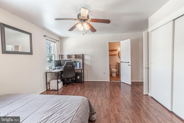 bedroom featuring ensuite bathroom, dark hardwood / wood-style floors, ceiling fan, and a closet