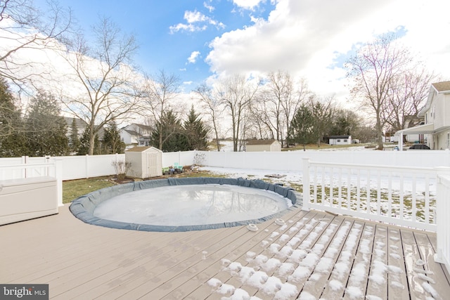 exterior space featuring a deck and a storage unit