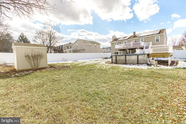 view of yard with a swimming pool side deck