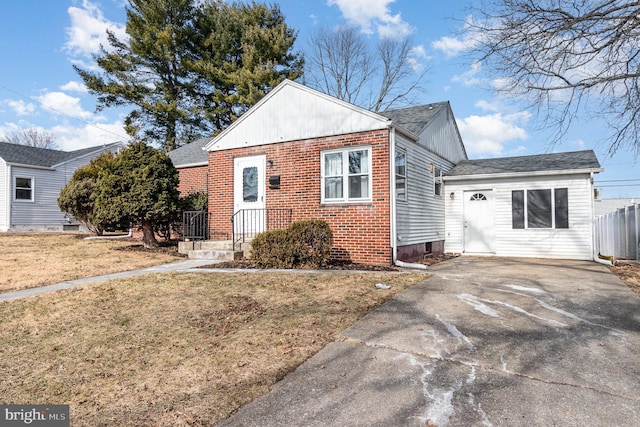 bungalow-style home featuring a front yard