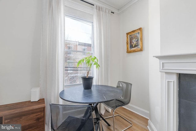 dining room featuring ornamental molding and hardwood / wood-style floors