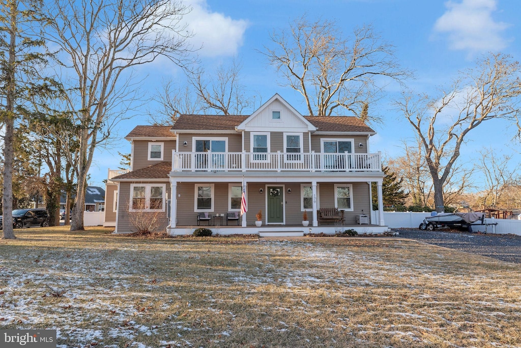 view of front of house with a balcony and covered porch