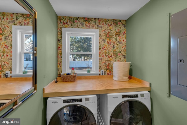 washroom with plenty of natural light and washing machine and dryer