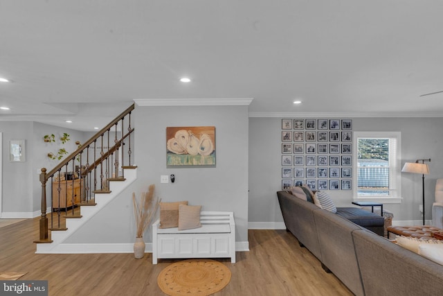 living room featuring light hardwood / wood-style flooring and ornamental molding