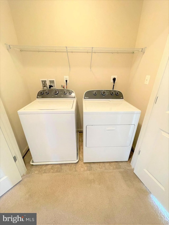 laundry room with independent washer and dryer