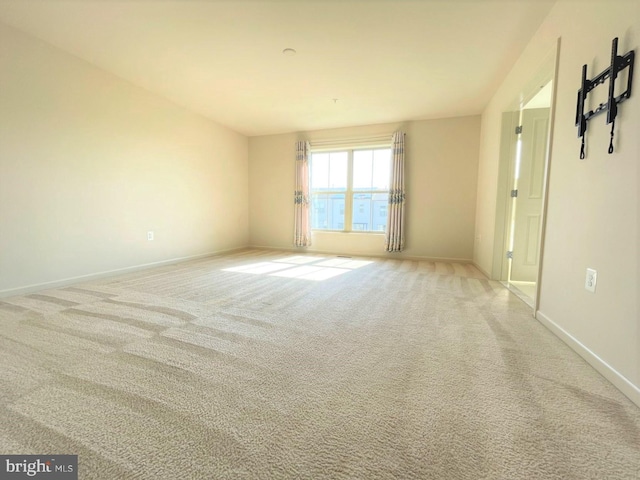 unfurnished room featuring carpet flooring