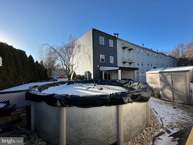 view of swimming pool with an outbuilding