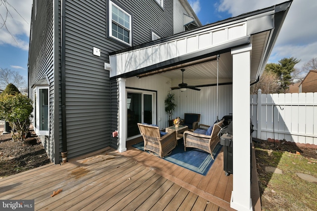 deck with ceiling fan and an outdoor hangout area