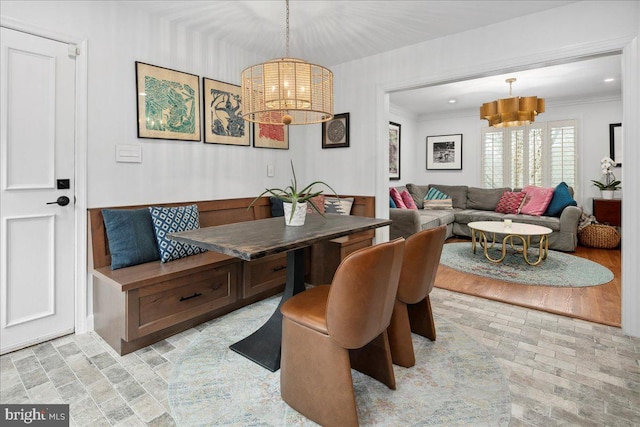 dining area with crown molding