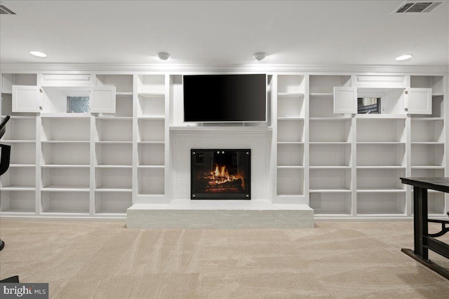 unfurnished living room with a brick fireplace and light carpet