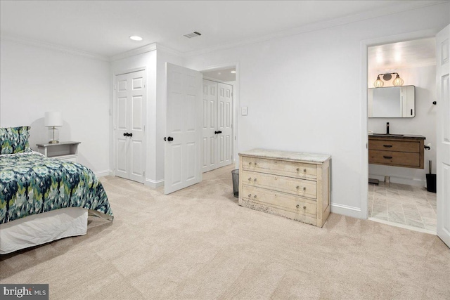 carpeted bedroom with crown molding